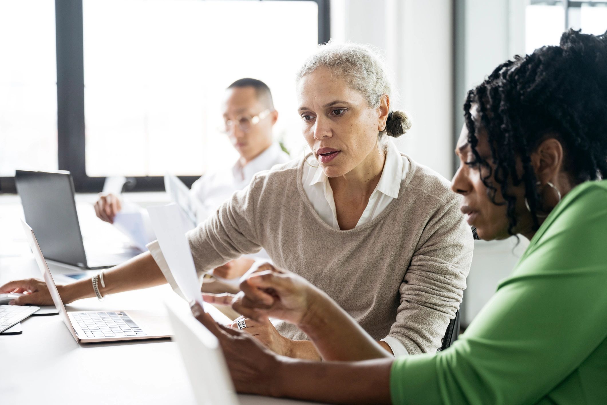 Women discussing finances at a workshop table